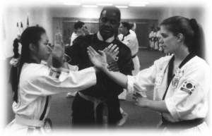 Head National Instructor adjusts students' sparring